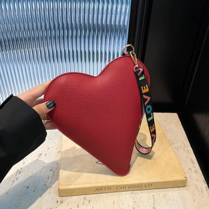 Red heart-shaped handbag with lychee grain leather and LOVE printed black strap