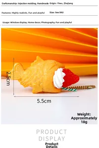 Detailed view of handmade miniature Taiyaki keychain with cream strawberry and bead chain