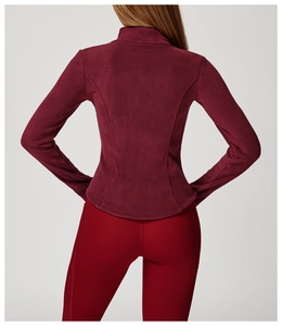 Detail of burgundy fleece jacket showing slim fit cut and high collar from the back view