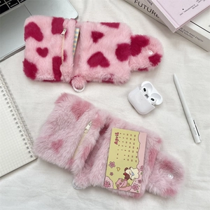 Detailed plush pink storage pouch with heart pattern and zipper closure for accessories
