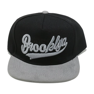 Detail of Brooklyn 3D embroidery on black and grey flat brim snapback baseball cap