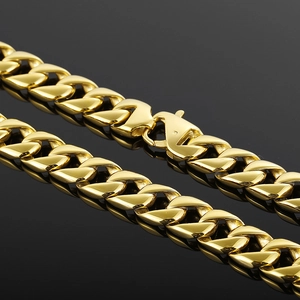 Polished 15mm golden Cuban link chain for men with lobster clasp on a reflective surface