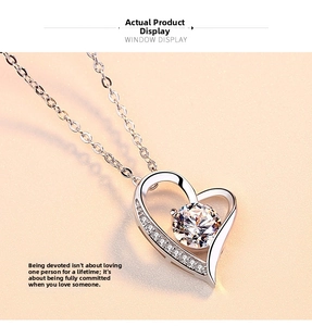 Macro detail of S925 silver heart necklace with sparkling zircon pendant and link chain