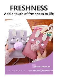 Detail of cartoon rabbit ear phone crossbody bag with plush pom-pom and cute print