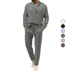 Detail of gray-green linen texture on men long sleeve shirt and drawstring pants set