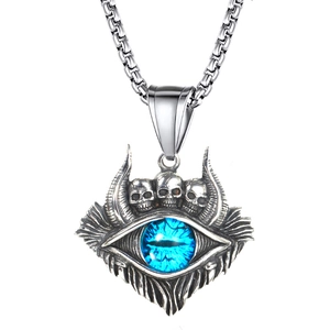 Vintage silver skull necklace featuring a large blue Turkish evil eye monster pendant