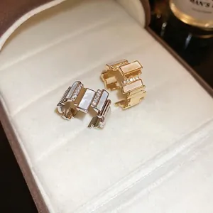 Adjustable gold and silver geometric rings with shell inlay and cubic zirconia stones