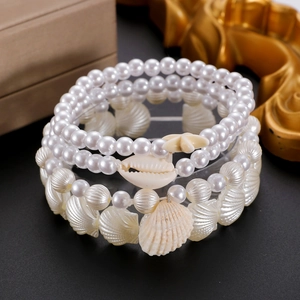 Set bracciali multistrato bohémien con perle conchiglie e stelle marine stile mare