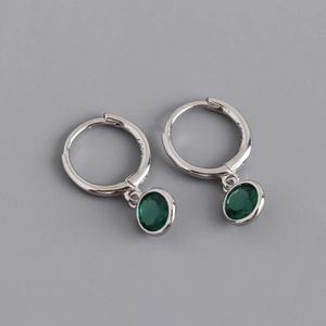 Close-up of S925 sterling silver hoop earrings with round emerald green zircon drops