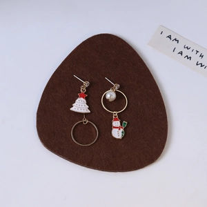 Asymmetric Christmas earrings featuring a festive tree, snowman, pearls, and gold rings