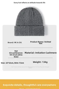Detailed view of dark grey cable knit beanie showing cashmere-like texture and measurements