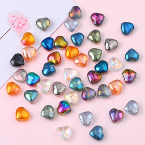 Macro shot of 10mm iridescent heart-shaped glass crystal beads in assorted colors