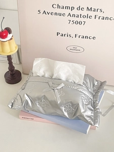 Silver puffy bow tissue box cover in metallic waterproof fabric with bow-knot detail