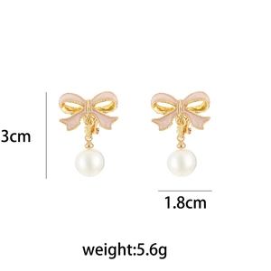 Pink bow and pearl drop earrings detailing 3cm height and 1.8cm width dimensions