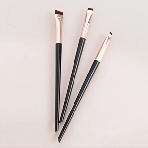 Set of 3 professional angled eyeliner and eyebrow brushes with black handles and rose gold ferrule