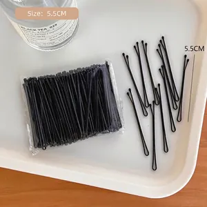 Detailed 5.5cm black metal bobby pins with protective round tips in a set