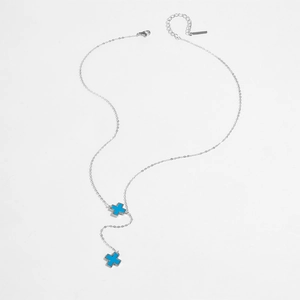 Elegant S925 sterling silver necklace with two turquoise cross pendants on white background
