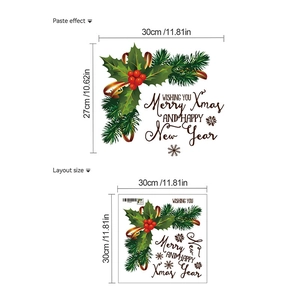 Detail of Christmas wall sticker showing Merry Xmas lettering with holly leaf and berry wreath