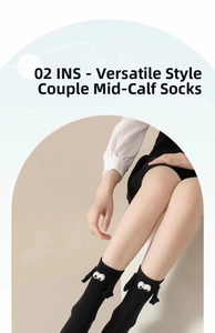 Detail of black couple socks featuring 3D cartoon eyes and magnetic magnetic small hands