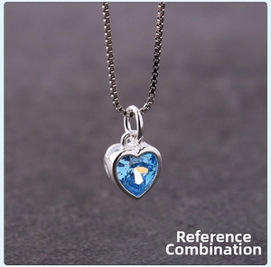 Macro detail of S925 silver heart necklace featuring a dark blue zircon stone pendant