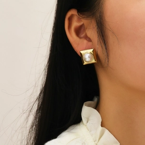 Vintage gold square earrings with white pearl inlay in a classic French luxury style