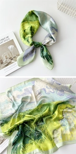 Detail of silk scarf with artistic oil painting print in green and purple hues