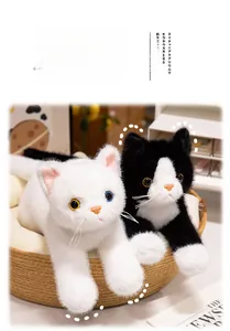 Detail of two realistic plush cats in a woven basket with fluffy faux fur and lifelike eyes