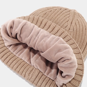 Thick knitted beanie with warm fleece lining in camel color for winter outdoor protection