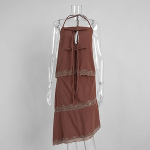 Detailed close-up of dark brown halter top with lace trim and delicate bow decoration