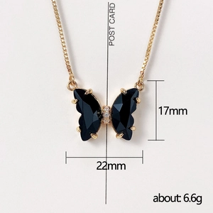 Elegant butterfly necklace with black faceted gemstones and gold-tone box chain