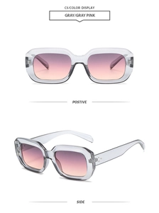 Detail view of square gray sunglasses with pink gradient lenses and metal rivet accents