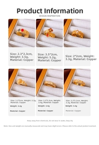 Detailed grid view of assorted gold-plated copper rings with floral and charm accents