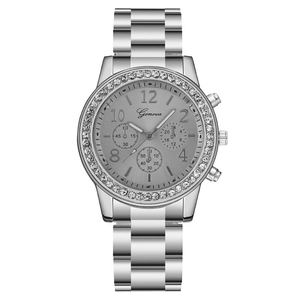 Montre à quartz Geneva pour femme avec lunette en strass et bracelet en acier