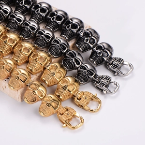 Gothic skull link bracelet in vintage silver and gold plating on stone base