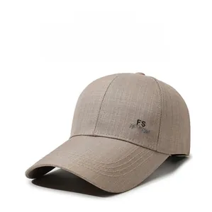 Detail of khaki baseball cap featuring fine twill fabric and side logo embroidery