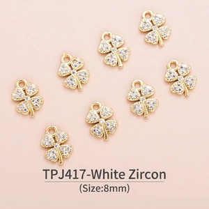 Detailed macro view of 8mm gold-plated four-leaf clover charms with white zircon inlay