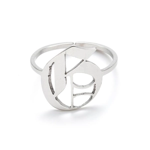 Macro detail of silver adjustable open ring featuring a hollow Gothic letter G design