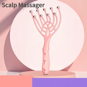 Pink nine-claw head massager with twelve metal rollers for scalp relaxation and stress relief