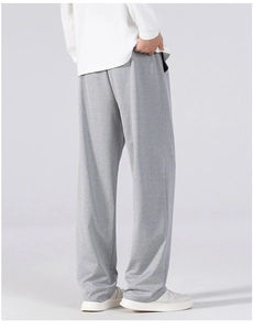 Men's relaxed fit grey jogger pants showing the natural drape and soft cotton texture
