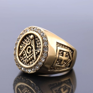 Gold Masonic ring with crystal compass G symbol and side cross detail on mirror surface