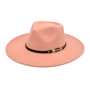 Pink wool felt fedora hat with black band and gold buckle on a white background