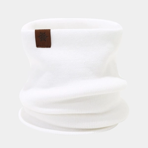 Detail of white knit neck warmer featuring a soft texture and snowflake leather patch