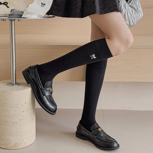 Japanese style black cotton knee high socks with white embroidered bow on the side