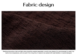 Detail of dark brown knit fabric texture with elegant pleated design and washing care info