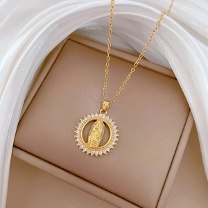 Gold Virgin of Guadalupe pendant necklace with cubic zirconia in a luxury jewelry box