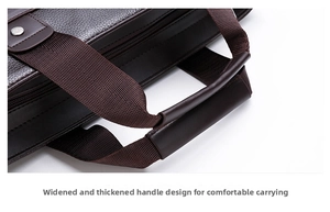 Detail of widened brown leather handle and woven strap on a men's business briefcase