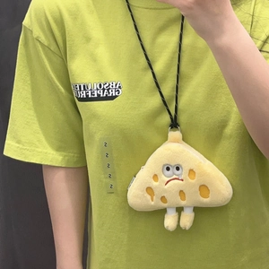Macro detail of cheese-shaped yellow plush coin purse with embroidered sad face