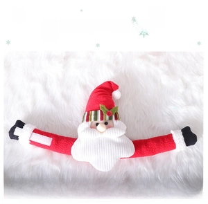 Detailed view of Santa Claus curtain tieback with velcro closure on plush background