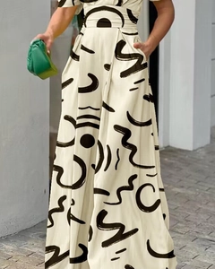 Detail of cream long jumpsuit featuring black abstract line print and high waist cut