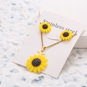 Stainless steel sunflower jewelry set with necklace and stud earrings on card